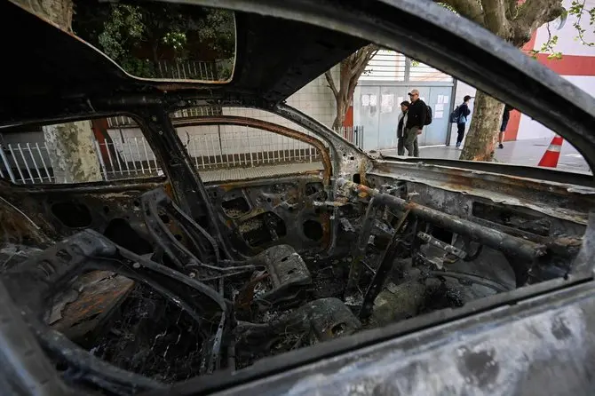 AFP/„Scanpix“ nuotr./Sudegintas automobilis, kuriuo, kaip įtariama, vežtos Brenda del Castillo, Morena Verdi ir Lara Gutierrez